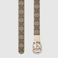 Beige belt with a gold buckle on a light gray background
