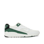 White sneaker with green and black pattern on a white background