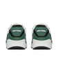 Green and white sneakers with brand logo on a white background