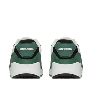 Green and white sneakers with brand logo on a white background