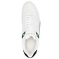 White sneaker with green accents on a white background