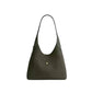Dark green handbag on a light gray background