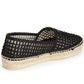 Black woven espadrille shoe on a white background