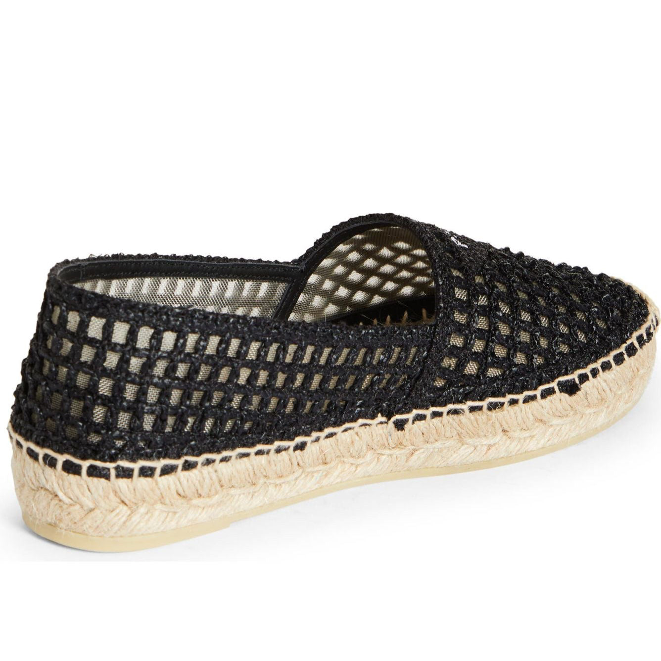 Black woven espadrille shoe on a white background