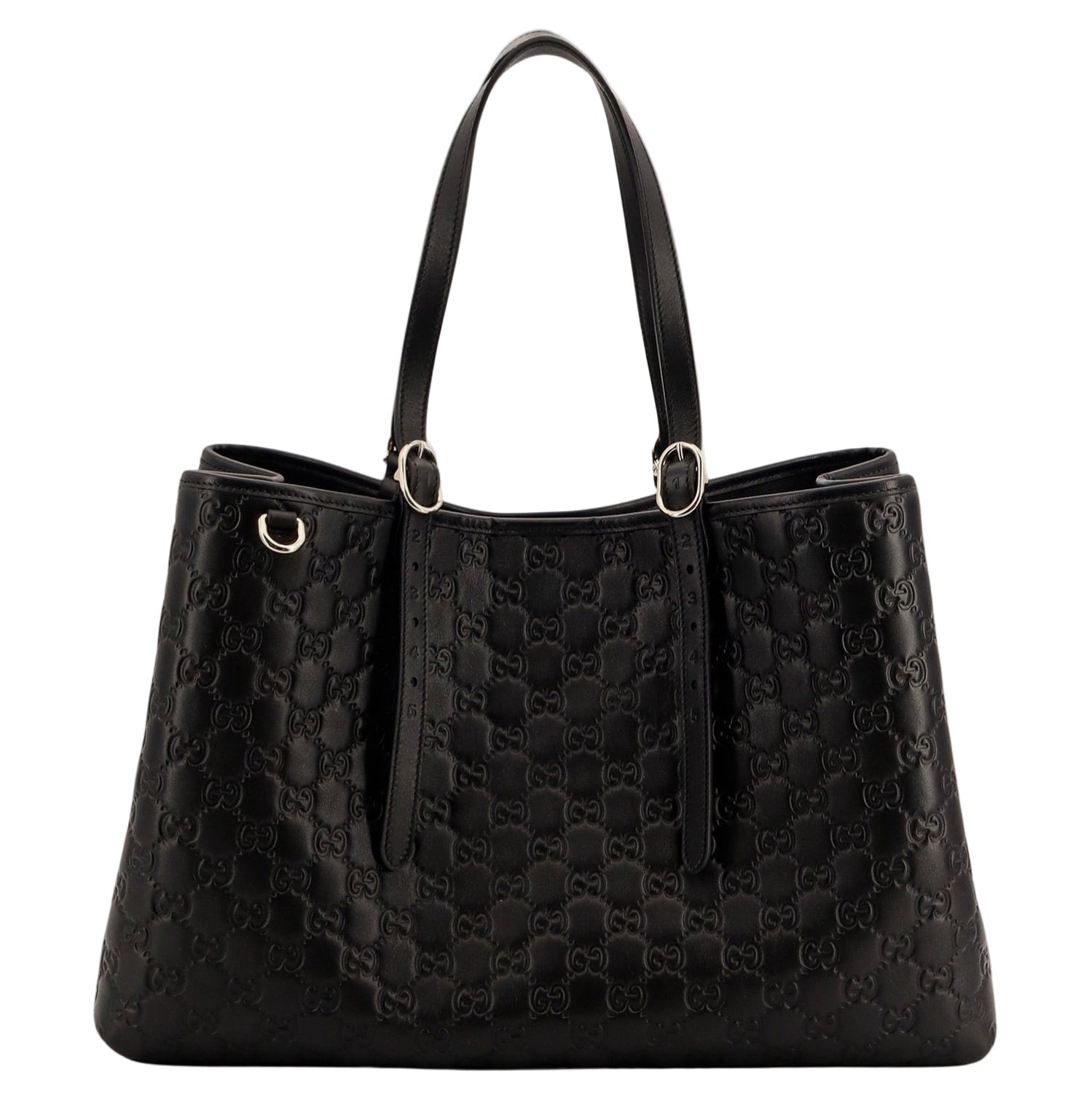 Black quilted handbag on a light gray background