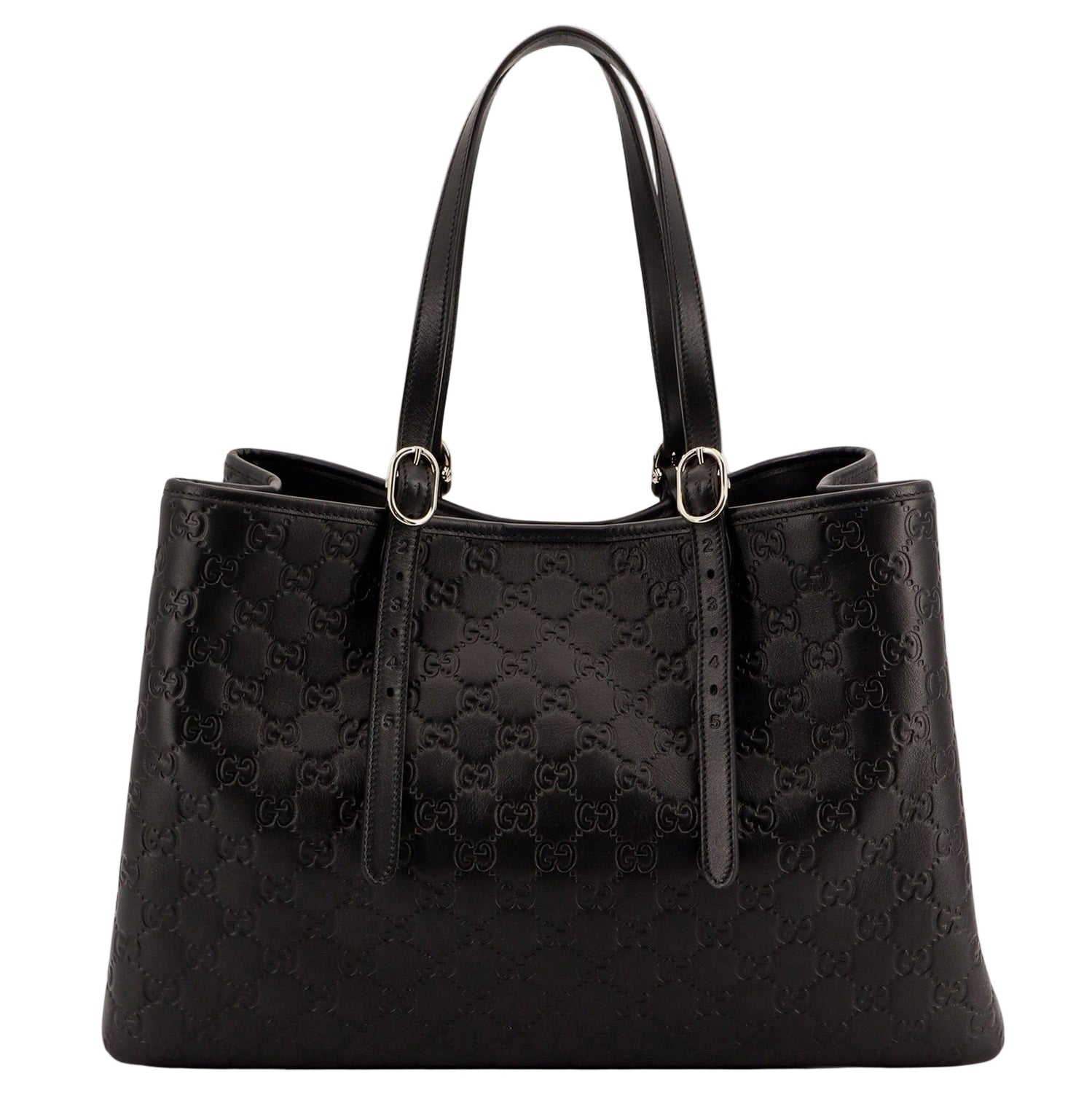 Black quilted handbag on a white background