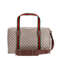 Designer handbag with distinctive red and green stripes on a white background
