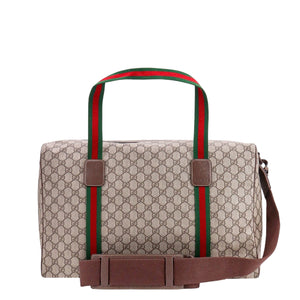 Designer handbag with distinctive red and green stripes on a white background