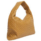 Brown woven handbag on a white background