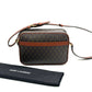 Designer handbag with brown strap and patterned body, next to a Saint Laurent branded pouch on a white background.