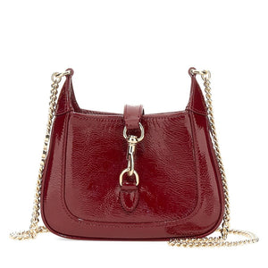Red handbag with gold chain strap on a white background