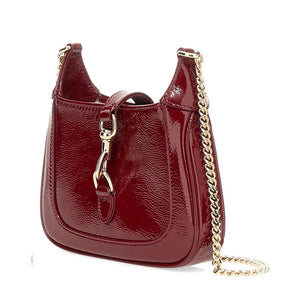 Red handbag with a gold chain on a white background