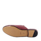 Maroon shoe sole with 'Gucci' branding on a white background